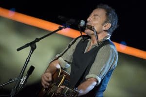 Bruce Springsteen plays harmonica and guitar during his set for The Concert for Valor in Washington, D.C. Nov. 11, 2014. DoD News photo by EJ Hersom